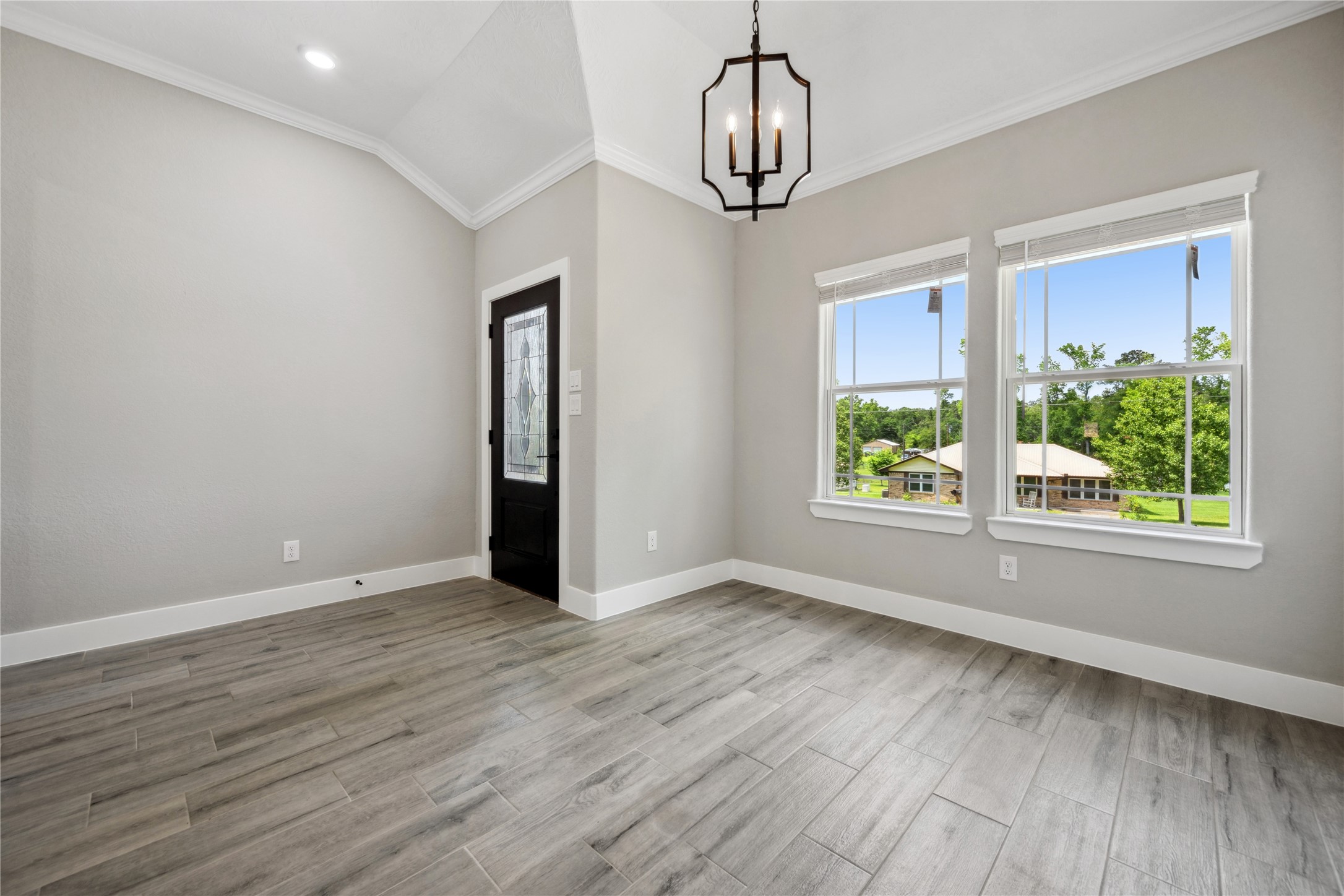 139 Popular Street Onalaska, TX 77360 - Photo 5 of 24 a view of empty room with wooden floor and window