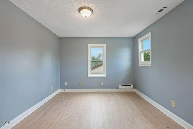 a view of a house with a yard and an outdoor space