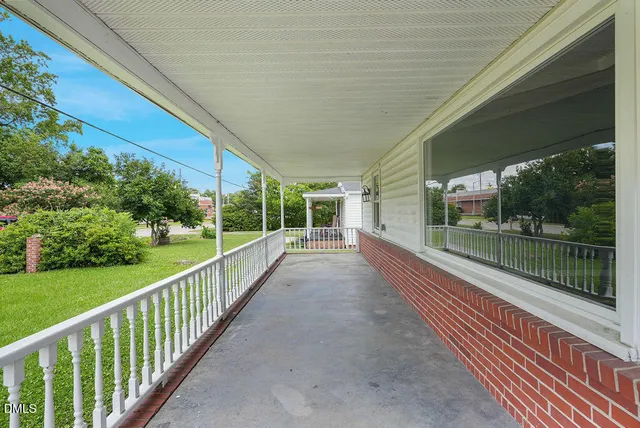 a view of balcony with yard