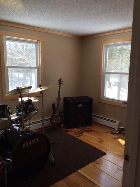 182 Peter Vier Road Durham, ME 04222 - Photo 14 of 19 A bright and sunny bedroom with...