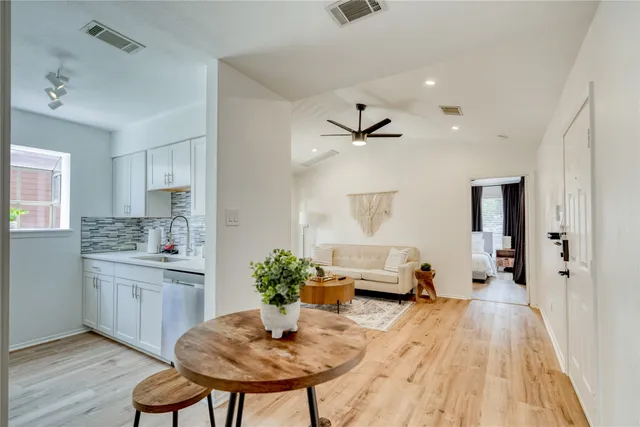a living room with furniture and a table