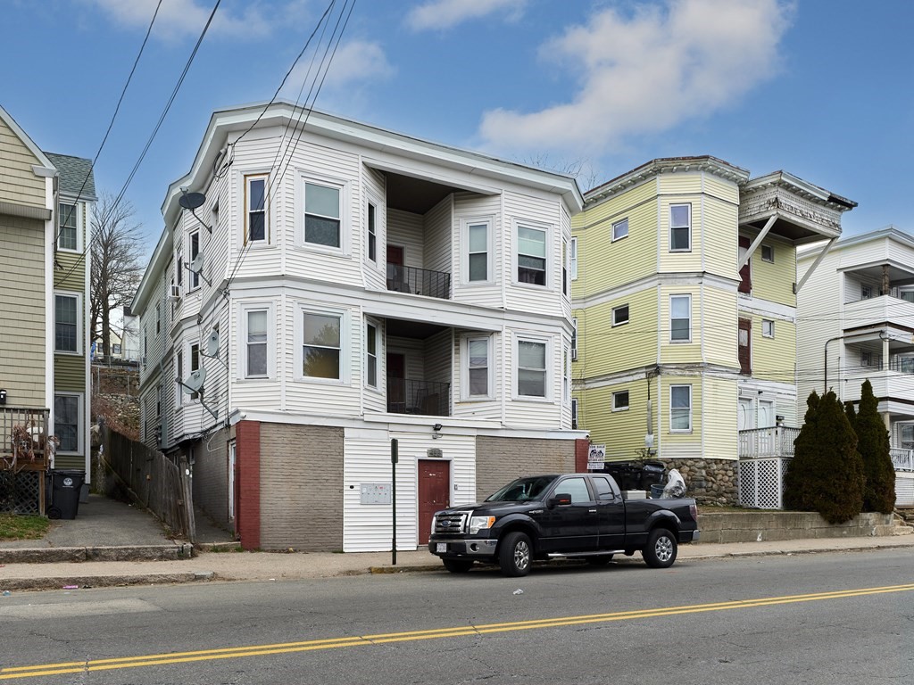 455 Washington Street Haverhill, MA 01832 - Photo 1 of 42 a car parked in front of a white building