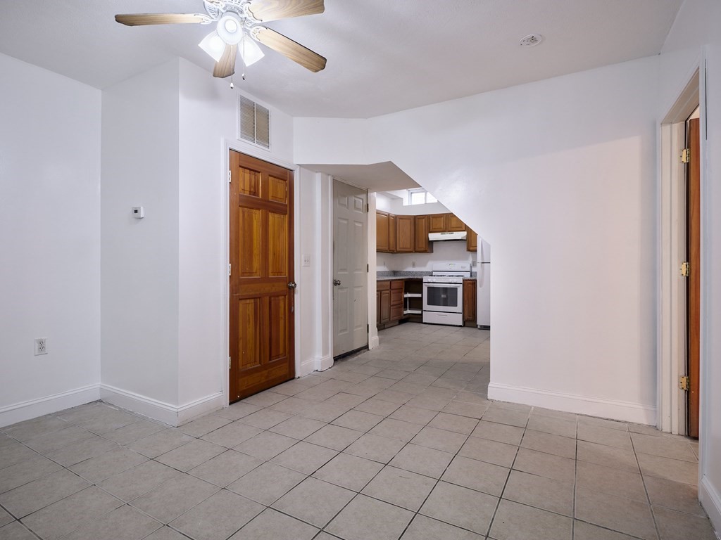 455 Washington Street Haverhill, MA 01832 - Photo 11 of 42 an empty room with chandelier fan and windows