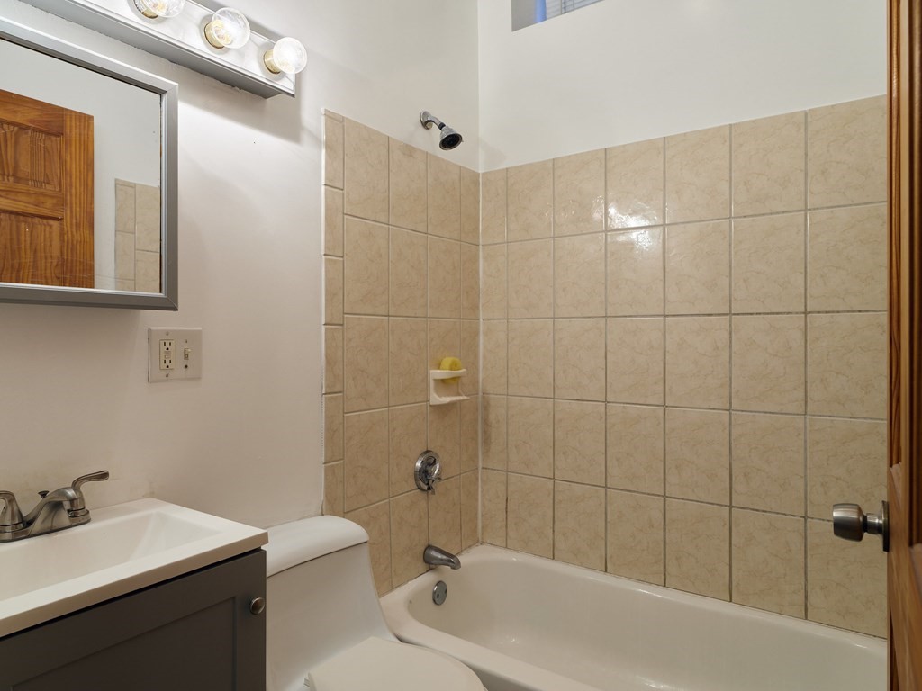 455 Washington Street Haverhill, MA 01832 - Photo 15 of 42 a bathroom with a sink mirror toilet and bathtub