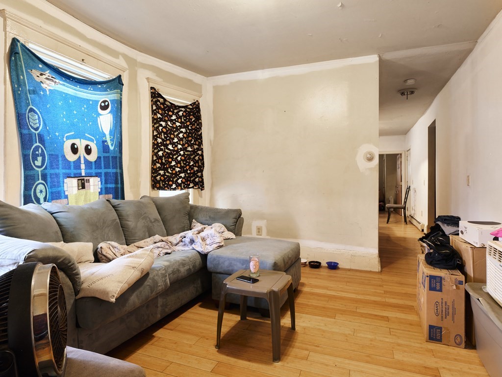 455 Washington Street Haverhill, MA 01832 - Photo 21 of 42 a living room with furniture and a wooden floor
