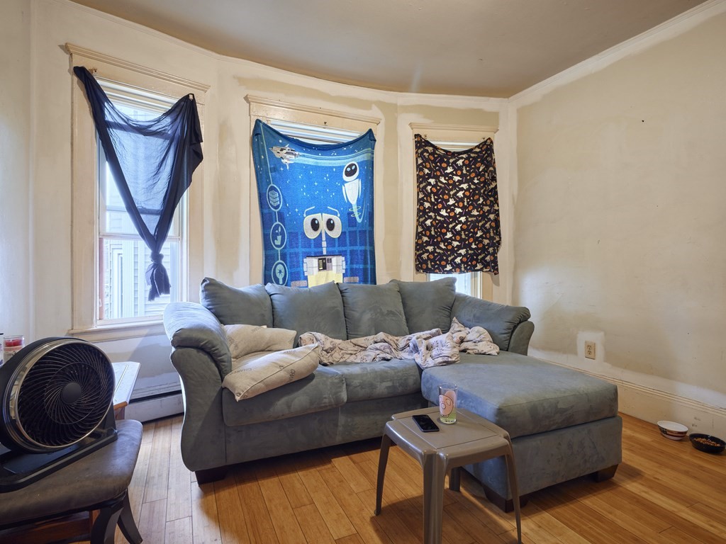 455 Washington Street Haverhill, MA 01832 - Photo 22 of 42 a living room with furniture a rug and a window