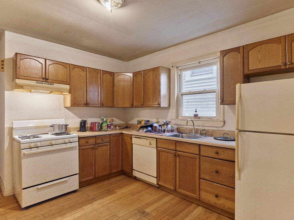 455 Washington Street Haverhill, MA 01832 - Photo 25 of 42 a kitchen with a white cabinets and white appliances