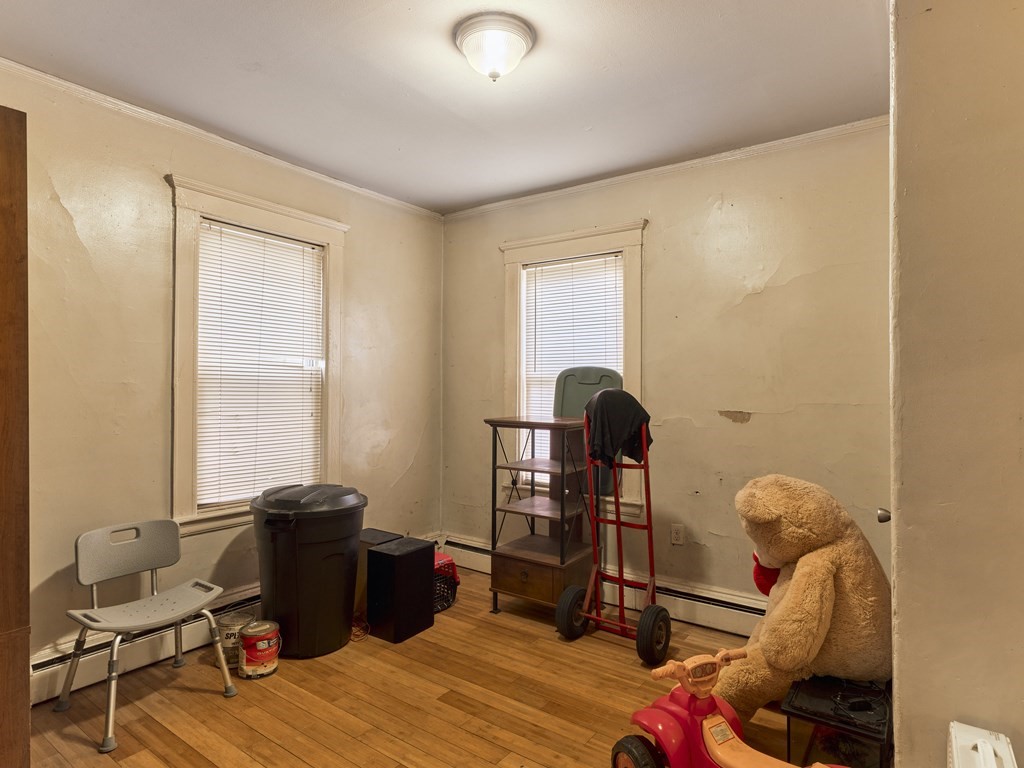 455 Washington Street Haverhill, MA 01832 - Photo 26 of 42 a bedroom with furniture and a window