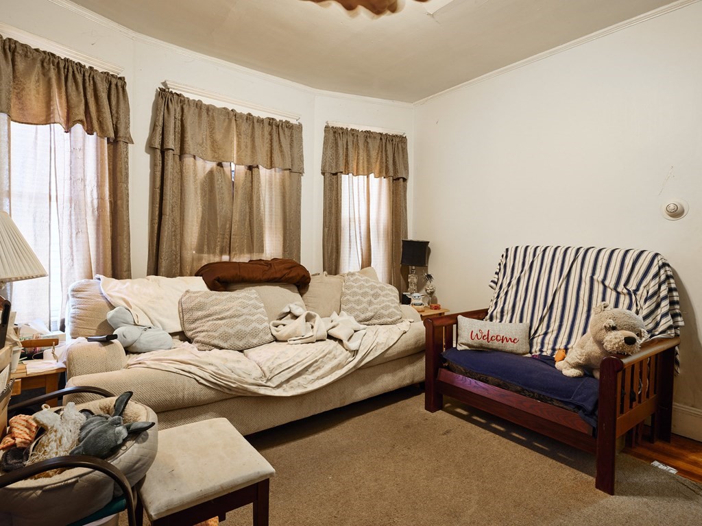 455 Washington Street Haverhill, MA 01832 - Photo 28 of 42 a bedroom with furniture and a large window