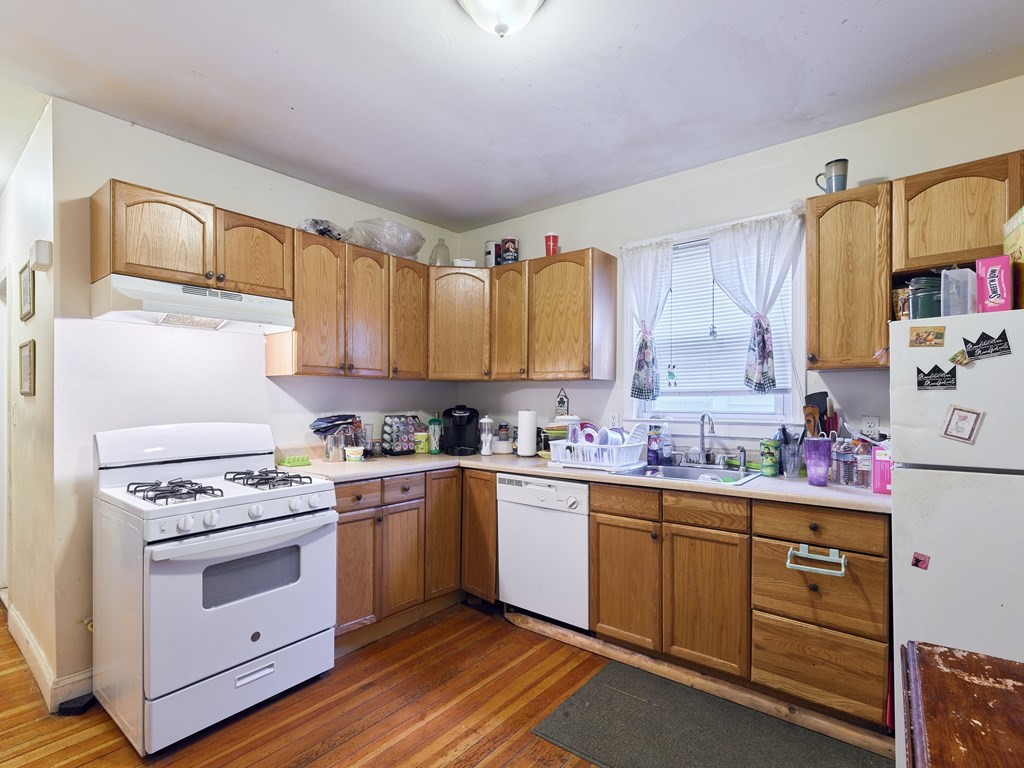 455 Washington Street Haverhill, MA 01832 - Photo 32 of 42 a kitchen with a stove a sink and cabinets