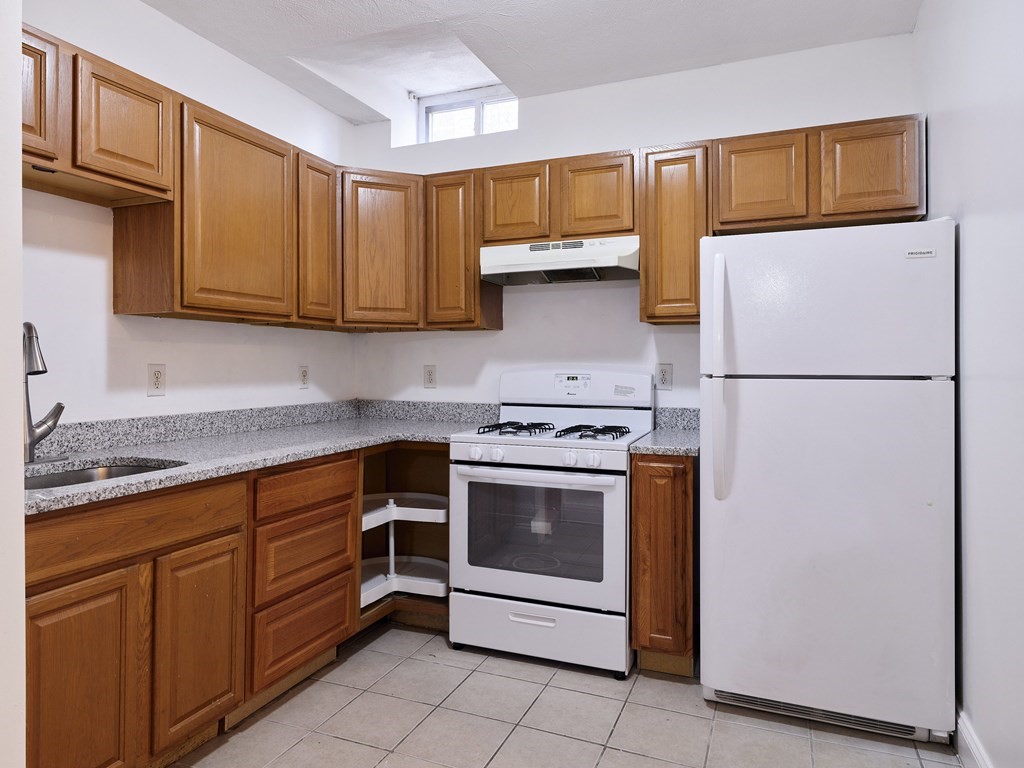 455 Washington Street Haverhill, MA 01832 - Photo 4 of 42 a kitchen with stainless steel appliances granite countertop a refrigerator stove a sink and dishwasher