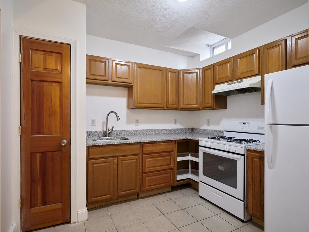 455 Washington Street Haverhill, MA 01832 - Photo 5 of 42 a kitchen with stainless steel appliances granite countertop a stove sink and cabinets