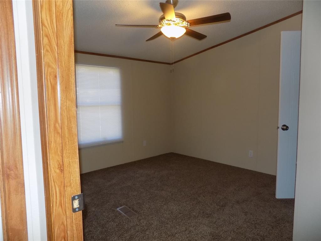 3450 Sarra Lane Springtown, TX 76082 - Photo 16 of 23 Carpeted secondary bedroom.