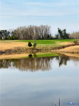 a view of lake with green space