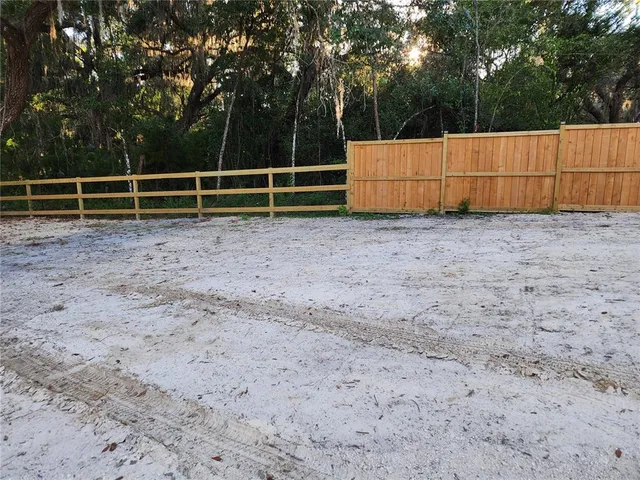 a view of backyard with green space