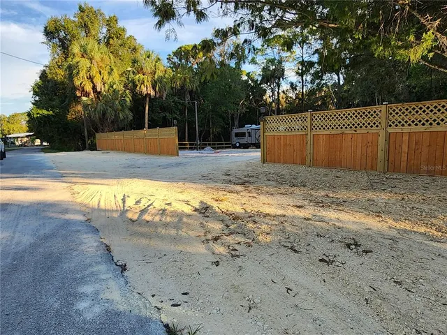 a view of a yard with swimming pool