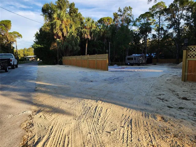a view of street with parked cars