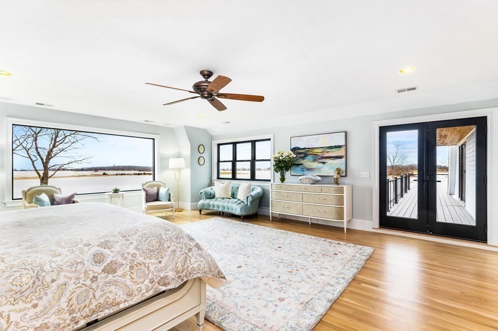20 Wood Island Road Scituate, MA 02066 - Photo 11 of 14 a bedroom with a large bed and a large window