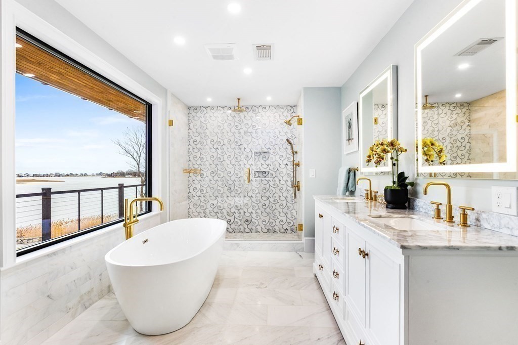 20 Wood Island Road Scituate, MA 02066 - Photo 12 of 14 a bathroom with a granite countertop bathtub sink vanity and mirror