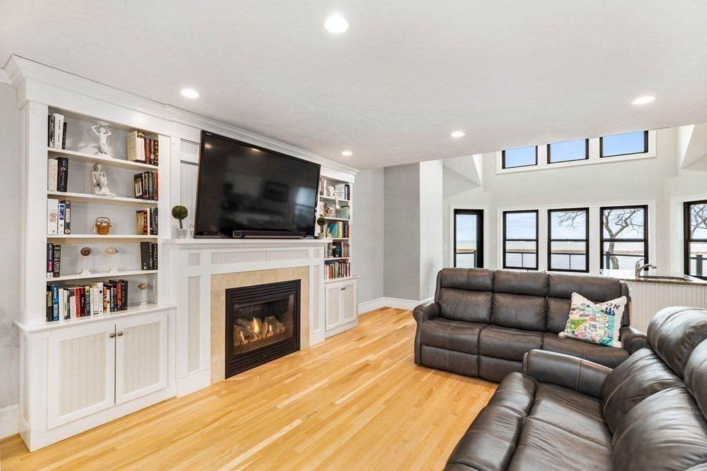 20 Wood Island Road Scituate, MA 02066 - Photo 13 of 14 a living room with furniture fireplace and flat screen tv
