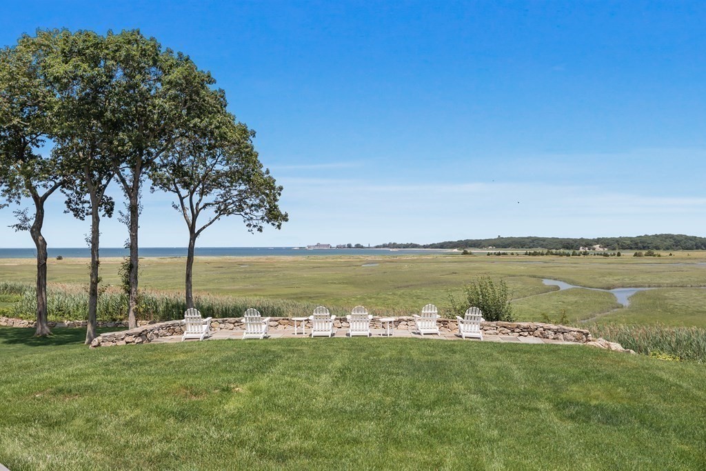 20 Wood Island Road Scituate, MA 02066 - Photo 14 of 14 a view of a lake with houses in the background