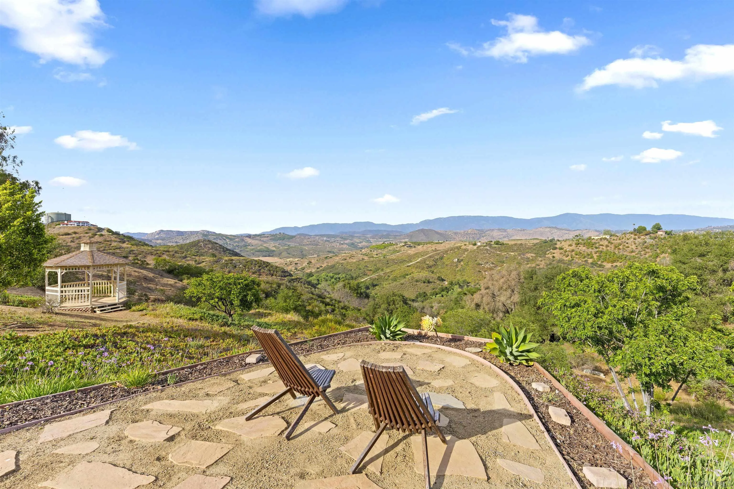 30659 Diaz Road Valley Center, CA 92082 - Photo 16 of 44 a view of a city from a balcony with furniture