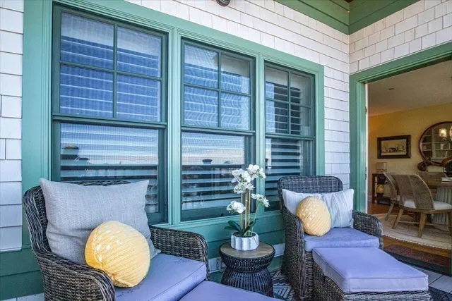 a view of balcony with furniture
