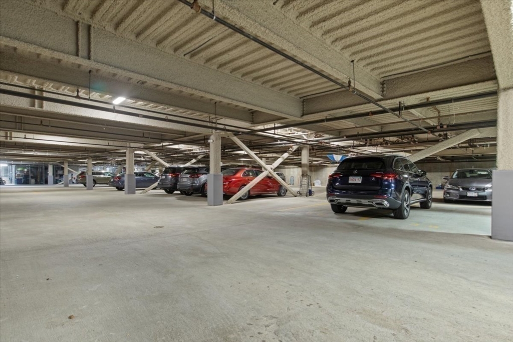 91 Front Street, Unit 308 Scituate, MA 02066 - Photo 25 of 27 a view of parking garage with cars