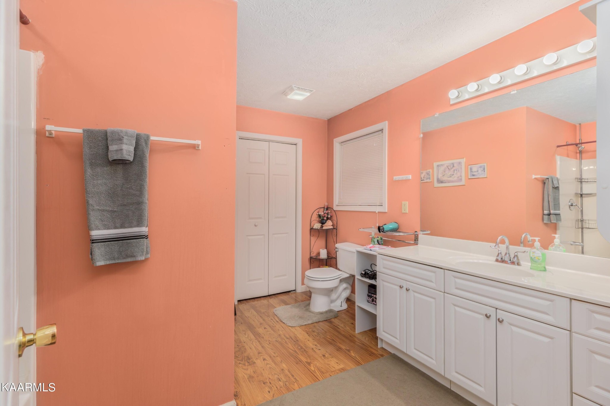 3226 Bogard Road Cosby, TN 37722 - Photo 15 of 35 a bathroom with a double vanity sink toilet mirror and shower