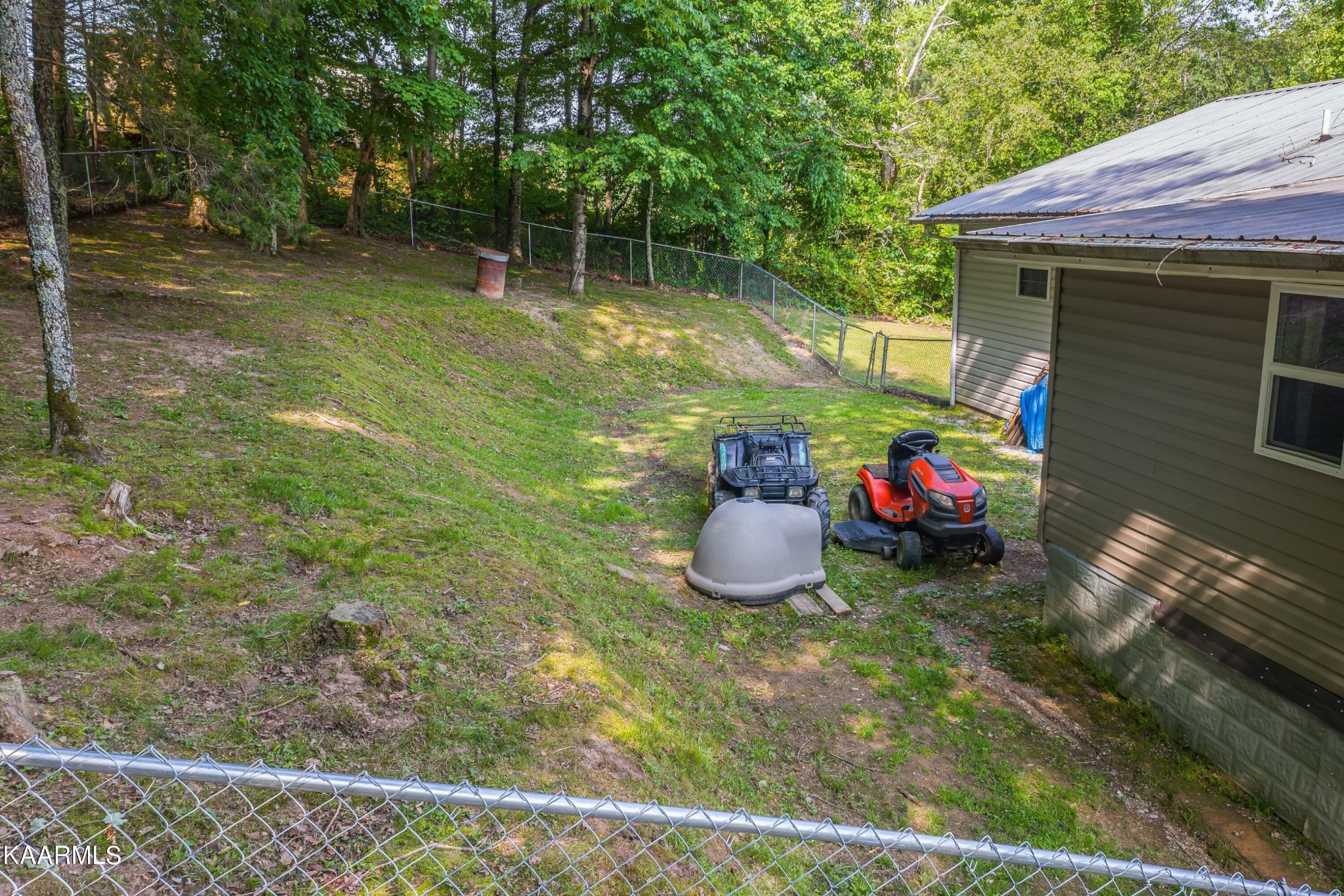 3226 Bogard Road Cosby, TN 37722 - Photo 26 of 35 a view of a backyard with table and chairs and barbeque grill