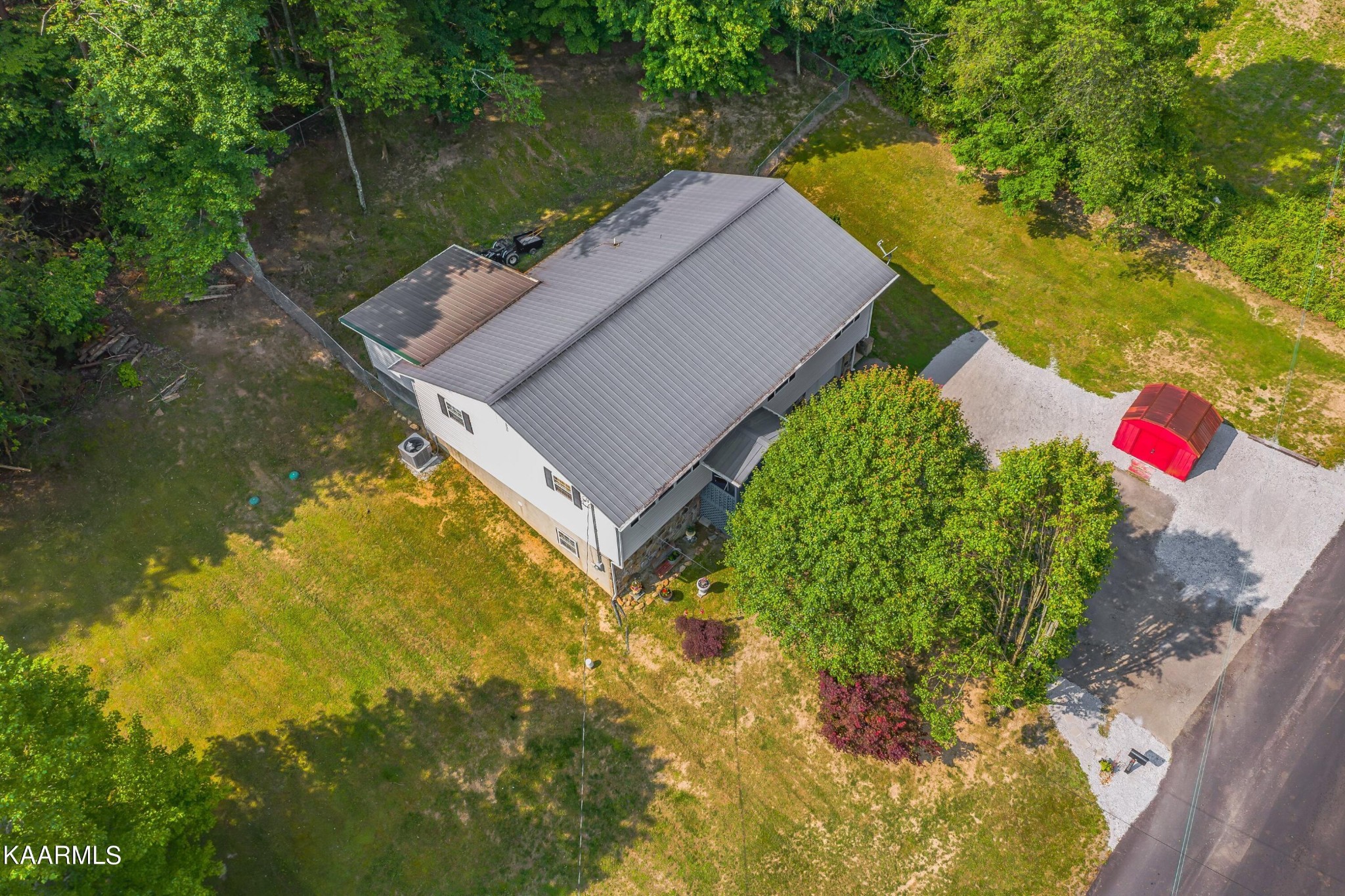 3226 Bogard Road Cosby, TN 37722 - Photo 30 of 35 a aerial view of a house with a yard and a large tree