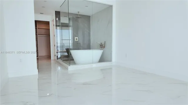 a kitchen with a sink and a refrigerator