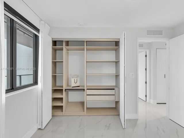 a large white kitchen with sink