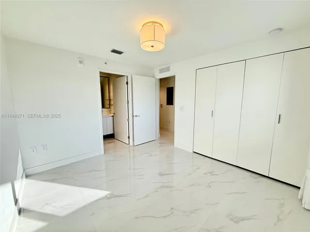 a view of a balcony with chairs and with furniture