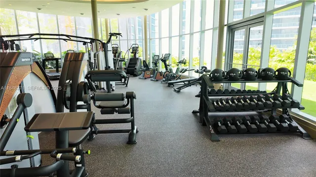 a room with furniture and a large window