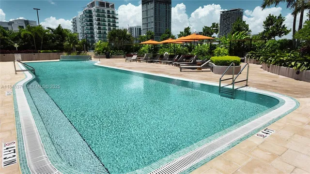a view of a balcony with furniture and a potted plant