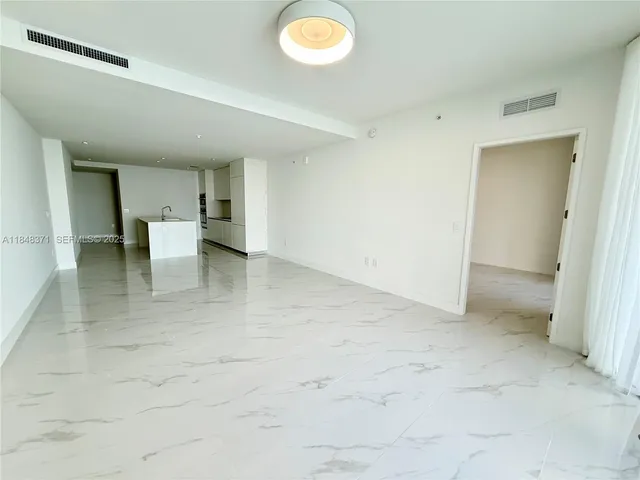 a spacious bathroom with a tub and shower