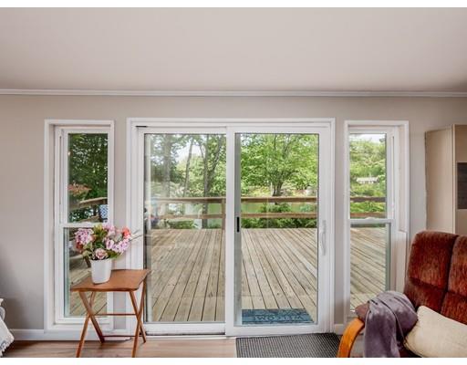 276 Lakeview Drive Winchendon, MA 01475 - Photo 11 of 37 a living room with furniture and a floor to ceiling window