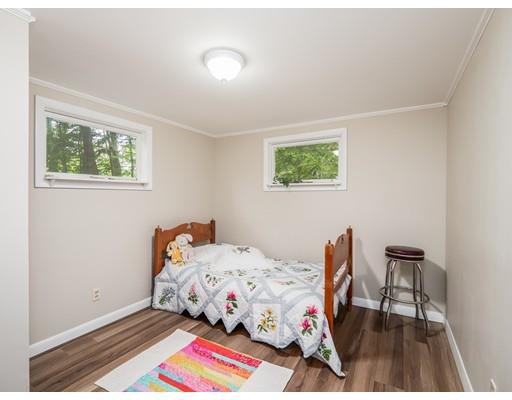 276 Lakeview Drive Winchendon, MA 01475 - Photo 14 of 37 a bedroom with a bed and a lamp next to a window