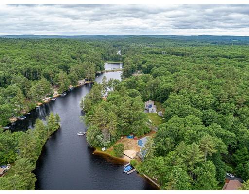 276 Lakeview Drive Winchendon, MA 01475 - Photo 29 of 37 a view of a garden with lawn chairs and large trees