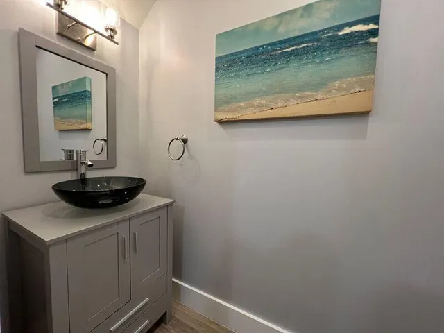 a bathroom with a sink and a mirror