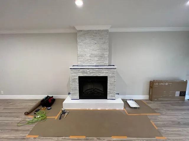 a living room with furniture and a fireplace
