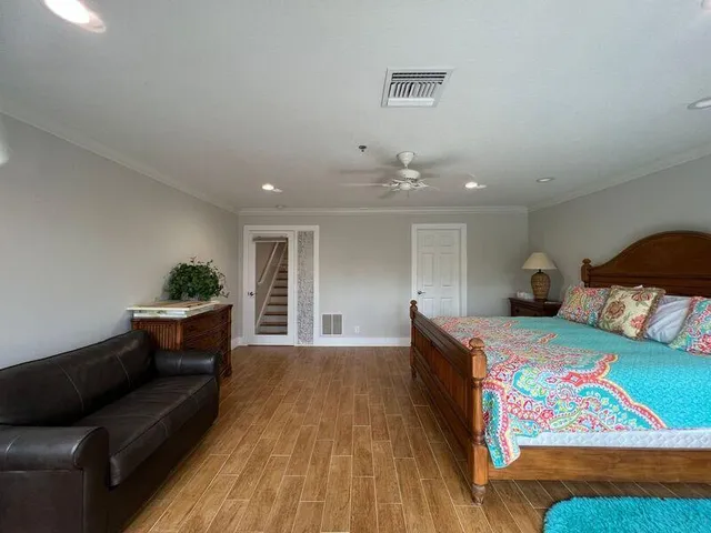 a bed room with a bed and a couch