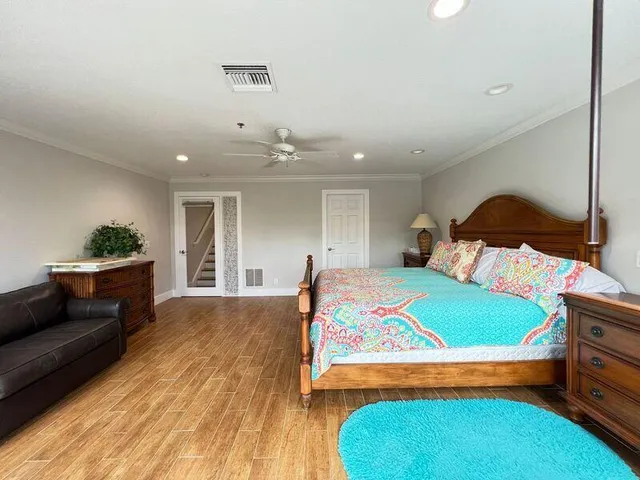 a bedroom with a bed and a dresser