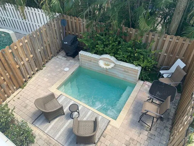 a view of a backyard with chair