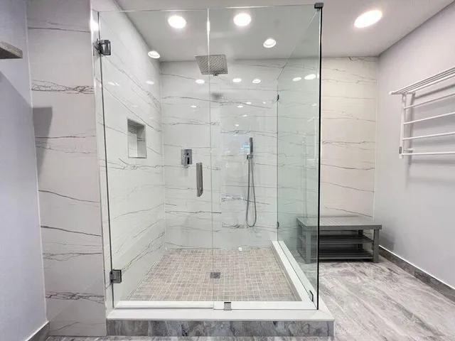 a white toilet sitting next to a bathroom sink