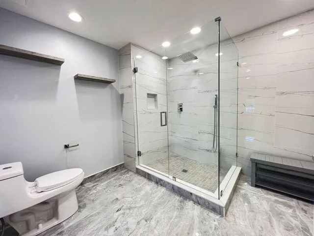 a close view of sink a mirror and a fan