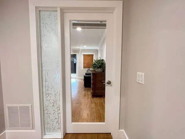 a bed room with a bed and a television