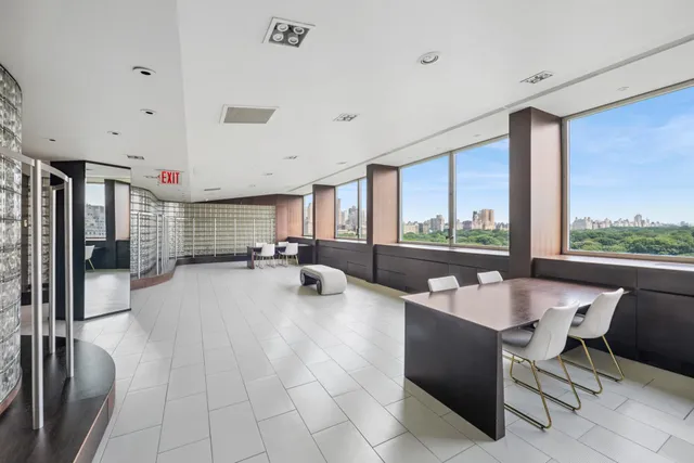 a very nice looking dining room with a large window