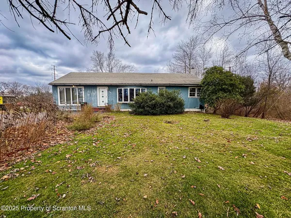 a view of house with yard and green space